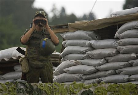 A Russian peacekeeper is seen at the checkpoint in the village of Khobi, September 8, 2008. http://warnewsupdates.blogspot.com/2008_08_11_archive.html Russia